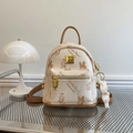 Mini beige faux leather backpack with Teddy Bear prints and brown trim on metal tray - With Pendant / White