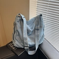 Hellblaue Shopper-Tasche aus Denim mit verstellbarem Gurt und Reißverschluss - Blau