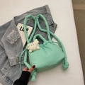 Mint green quilted bucket backpack with cloud pleats and a plush animal charm - Light Green With Charm