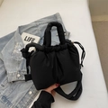 Chic black quilted puffer bucket bag featuring drawstring closure and padded handle - Black without Pendant