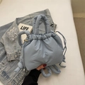 Chic light blue quilted bucket bag with soft padded handle and drawstring closure detail - Fog Blue (No Pendant)