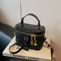 Chic black lychee grain leather vanity bag with gold hardware and shoulder strap - Black
