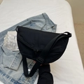 Sporty black nylon crescent crossbody bag with adjustable wide strap and multi-zippers - Black