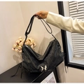 Minimalist black faux leather tote bag with silver butterfly charm and slim shoulder straps - Black