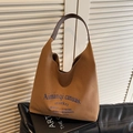 Caramel brown canvas tote bag with contrast shoulder straps and elegant blue typography - Caramel color
