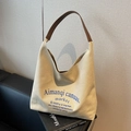 Beige canvas tote bag with brown leather straps and blue vintage lettering detail - Beige Grey