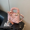 Pink quilted crossbody bag with pearl charms and silk scarf wrapped handle - Pink