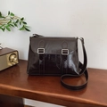Deep brown glossy oil-wax leather crossbody bag with silver buckles and retro texture - Brown
