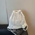 Chic white crochet mesh drawstring bag with daisy detail for casual summer outings - Off White