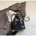 Elegant black bucket bag with embossed star patterns and golden buckle strap - Black without Pendant