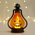 Dettaglio della lanterna a zucca di Halloween con calda luce LED e viso spaventoso - Nero Stile B