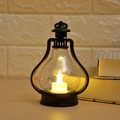 Detail of vintage black LED lantern on desk with warm light for home decor - Black