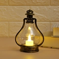 Macro shot of retro bronze LED lantern with warm light and glass cover for home decor - Bronze Gold