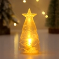Detail eines leuchtenden Weihnachtsbaum-Nachtlichts mit Goldglitzer und Sternspitze - Gelbes Licht (Silberpulver)