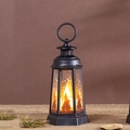 Detail of black Halloween lantern featuring orange light and castle bat patterns - Skull