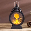 Macro shot of Halloween pumpkin lantern with vintage scrollwork and metal handle detail - Pumpkin