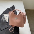 Sac seau matelassé rose avec fermoir rotatif argenté et poignée ronde élégante - Sans pendentif / Rose