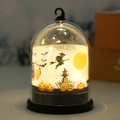 Dettaglio lampada a cupola di Halloween con silhouette di strega e luce LED calda - Strega