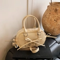 Chic cream bow Boston handbag with shiny finish and adjustable strap for women - White