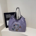 Purple canvas tote bag featuring butterfly embroidery and blue checkered straps - Purple