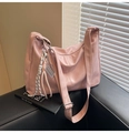 Detailed texture of a pink PU leather crescent bag with unique silver abacus pendant - With Charm / Pink