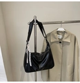 Detail of black large capacity shoulder bag with silver tennis racket charm and woven cord - With Charm / Black
