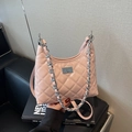 Pink quilted crossbody bag with silver chain handle and metallic twist lock for women - Pink
