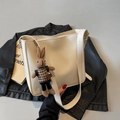 Cream white faux leather bucket bag with cute bunny pendant and wide shoulder strap - Cream White With Pendant