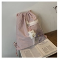 Pink drawstring backpack with transparent PVC front pocket and cute plush bear accessory - Pink