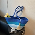 Large woven beach bag in blue gradient stripes with fringe tassel and wood bead detail - Blue