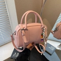 Pink lychee texture Boston handbag with beaded charm and adjustable shoulder strap - Pink with Pendant