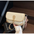 Chic cream textured crossbody bag with tan leather trim and woven cord detail - With Pendant / Off White