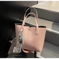 Pink matte leather tote bag detail with cute bear charm and striped scarf accessory - Pink