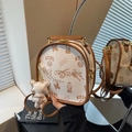 Chic beige lychee leather backpack with brown trim and cute cartoon bear pattern - Cream White With Pendant