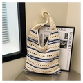 Detailed view of handmade hollow straw tote bag with navy blue stripes and woven texture - Striped Minimalist Knitted Style (Style 2)