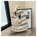 Detail of hand-woven striped tote bag featuring a large mesh bow and rose embroidery - Striped Bowknot Embroidery Style (Style 1)