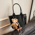 Black lychee texture bucket bag with cylindrical handles and cute plush bear charm - Black with Pendant