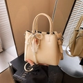 Cream bucket bag for women with pearl chain and bow ribbon detail in a crossbody style - With Charm / Yellow