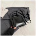 Minimalist black bucket bag with dual handles and adjustable strap in semi-gloss finish - No Pendant / Black
