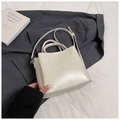 Minimalist cream white bucket bag with fixed top handle and slim crossbody strap - No Pendant / White