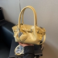 Light yellow bucket bag with heart charm, textured faux leather and adjustable strap - Yellow with Pendant