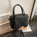 Minimalist black lychee texture crossbody bag with pleats and fringe tassel charm - Black