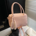 Pink lychee texture crossbody bag with elegant tassels and stylish pleated design - Pink