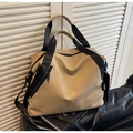 Close-up of khaki large capacity travel bag with black straps and side zipper pocket - Khaki