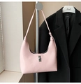 Detail of pink patent leather hobo bag with silver twist lock and glossy mirror finish - Pink