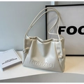 Close-up of cream leather tote bag featuring embossed logo detail and drawstring accents - Off-white Without Pendant