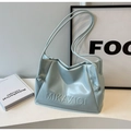 Detail of light blue glossy PU shoulder bag with soft cloud-like pleats and embossed logo - Blue Without Charm