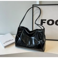Detail shot of black glossy leather shoulder bag with embossed texture and sleek strap - Black without Pendant
