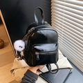 Mini black glossy faux leather backpack with a plush charm for casual travel and fashion - With Charm / Black