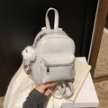 Chic beige small backpack with adjustable straps and a cute white plush keychain - With Charm / Gray